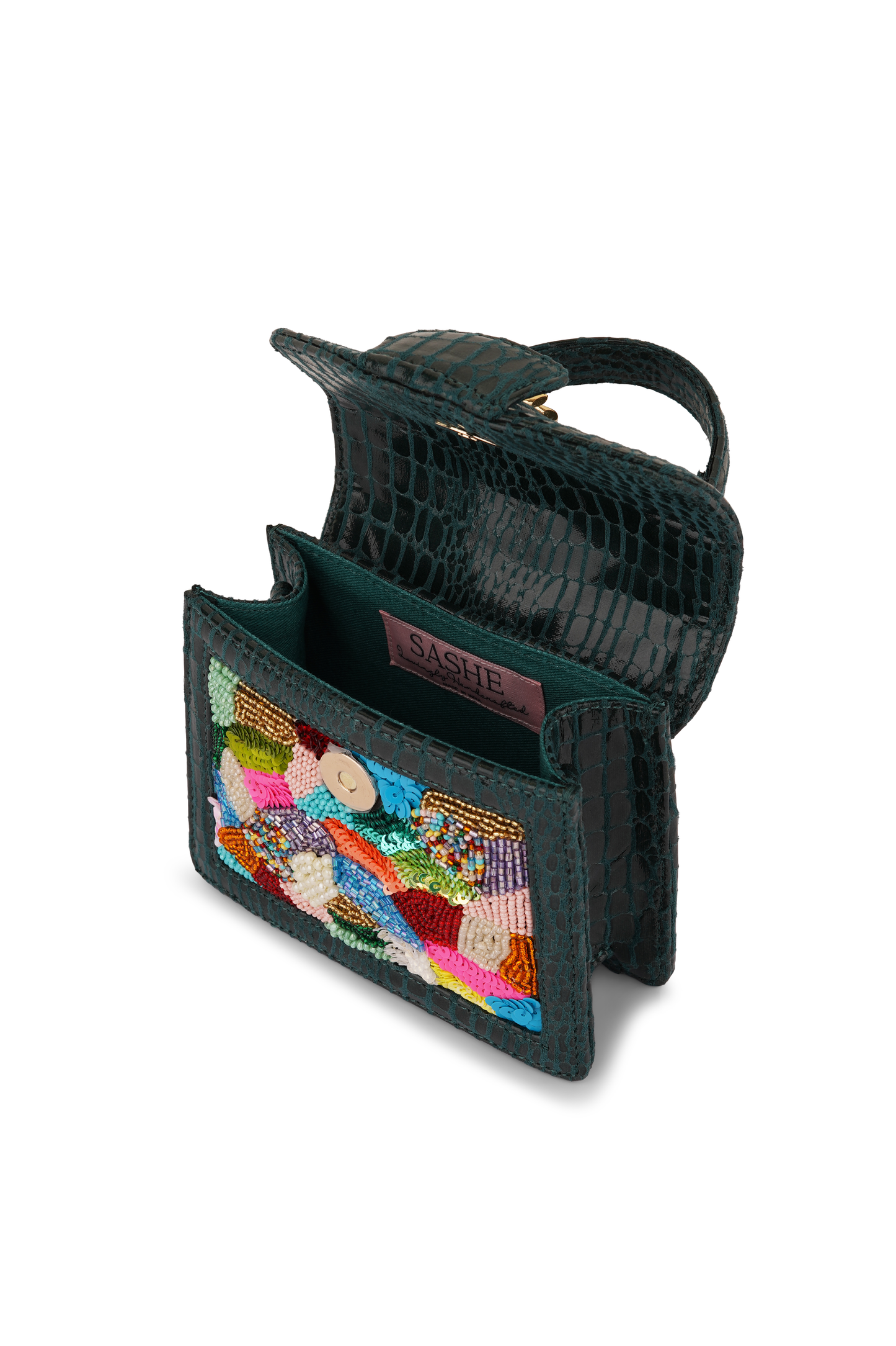Green handbag with colorful embroidered interior on a white background
